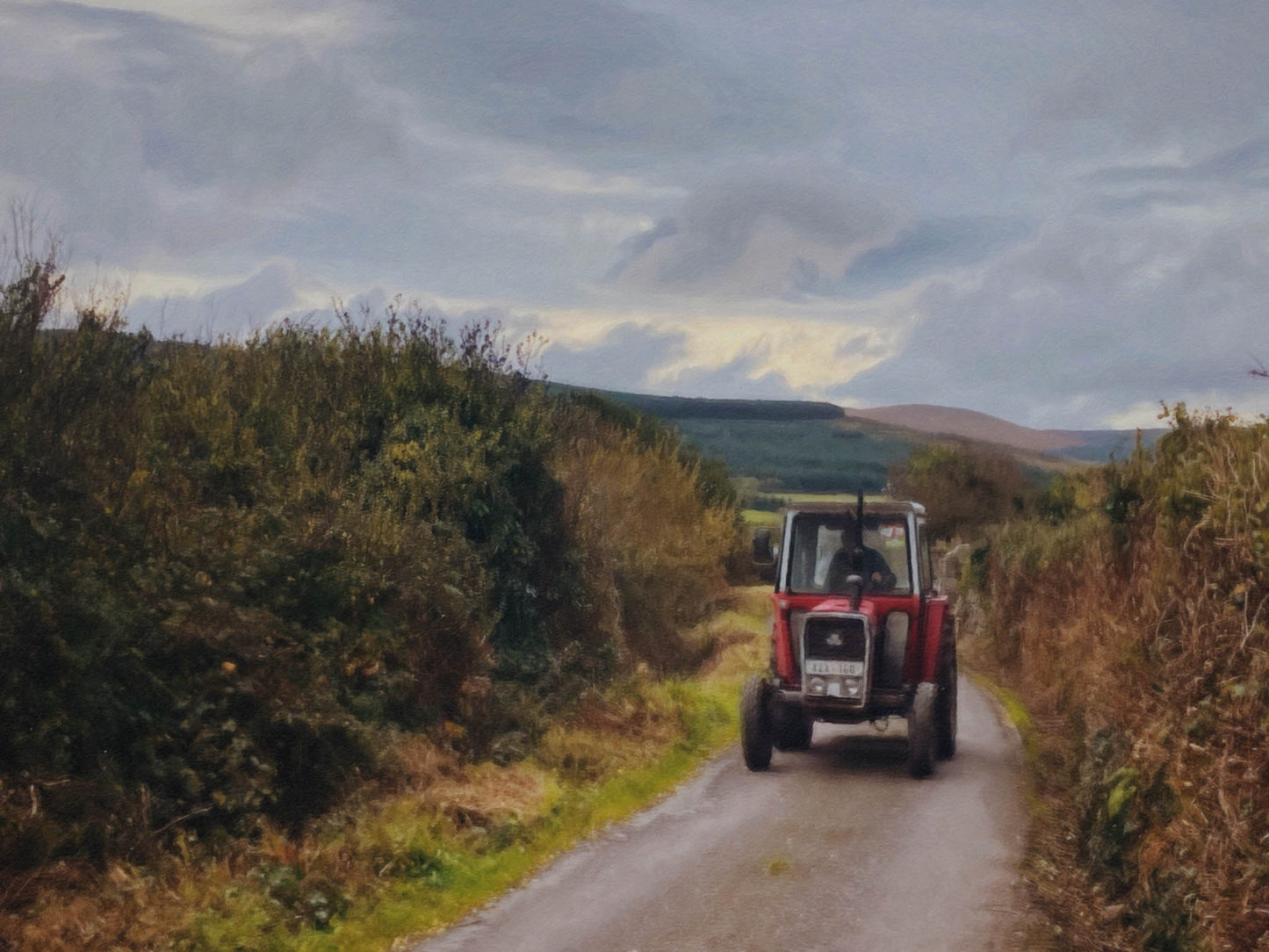 Transformed from a photograph into a soft, painterly print, this image captures the heart of rural Ireland—a lone red tractor making its steady way down a narrow country lane, framed by hedgerows and hills. The sky hangs heavy with quiet light, the land unfolding in gentle waves beyond. It’s a portrait of pace, patience, and place. Perfect for those who treasure the rhythm of country life and the timeless charm of Irish backroads.